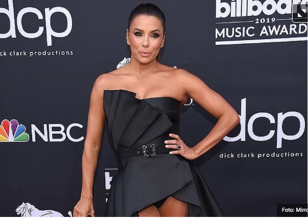 Eva Longoria in her bold, asymmetrical dress showed a black lower wig